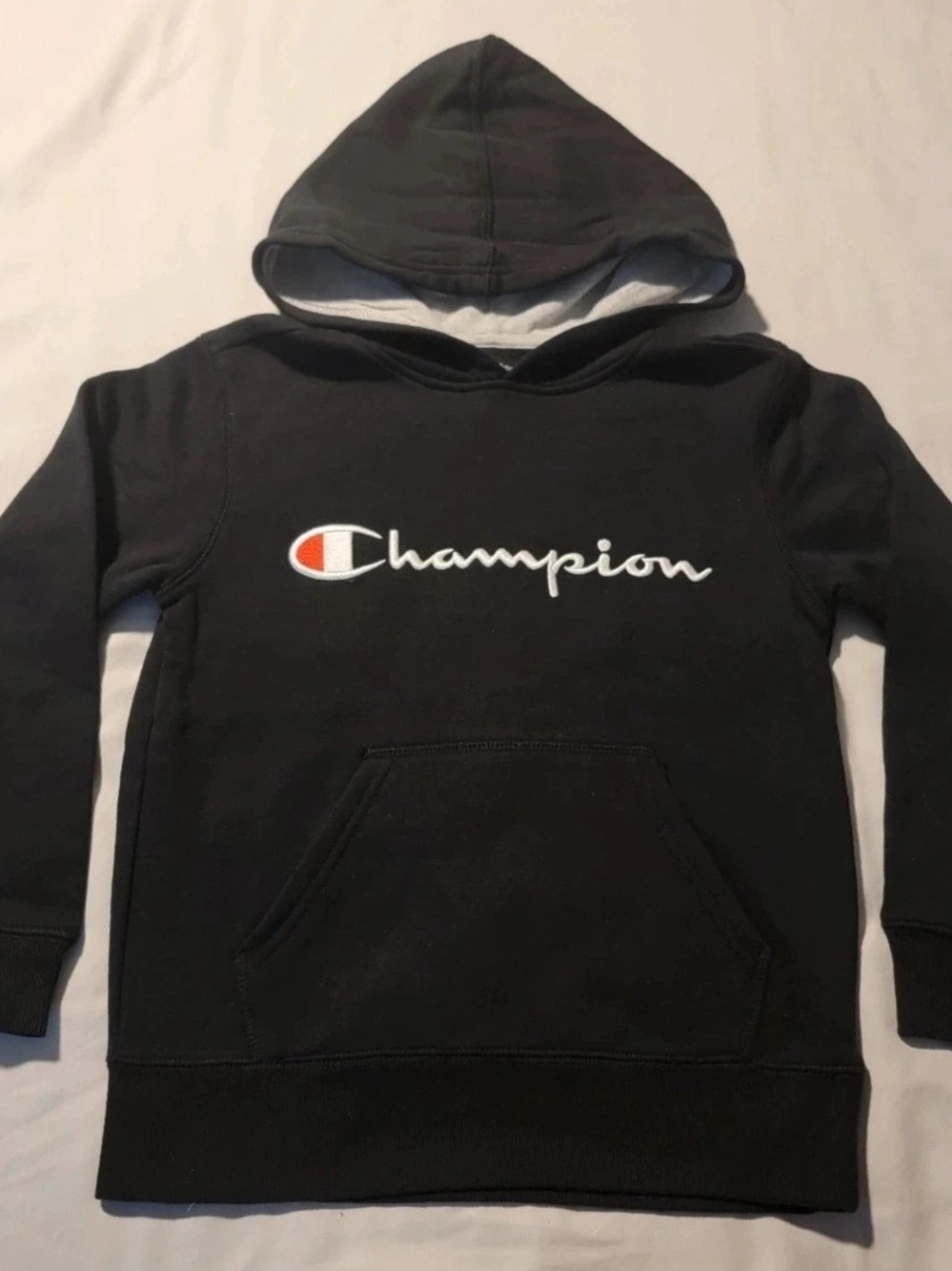 Champion Black Hoodie with Script Logo and Orange Accent